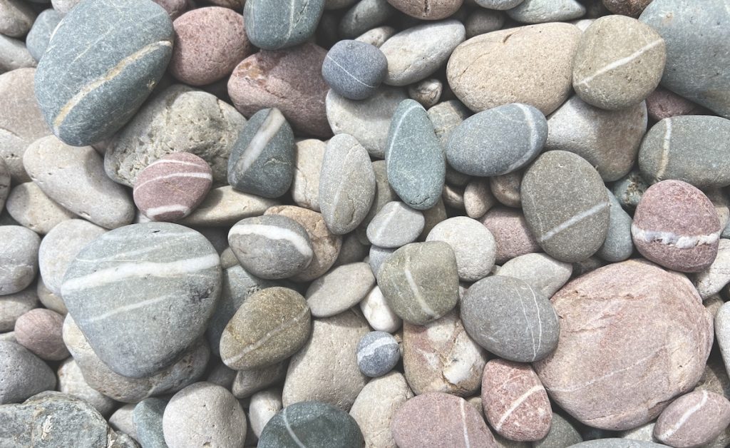 wishing stones and pebbles on a shingle beach